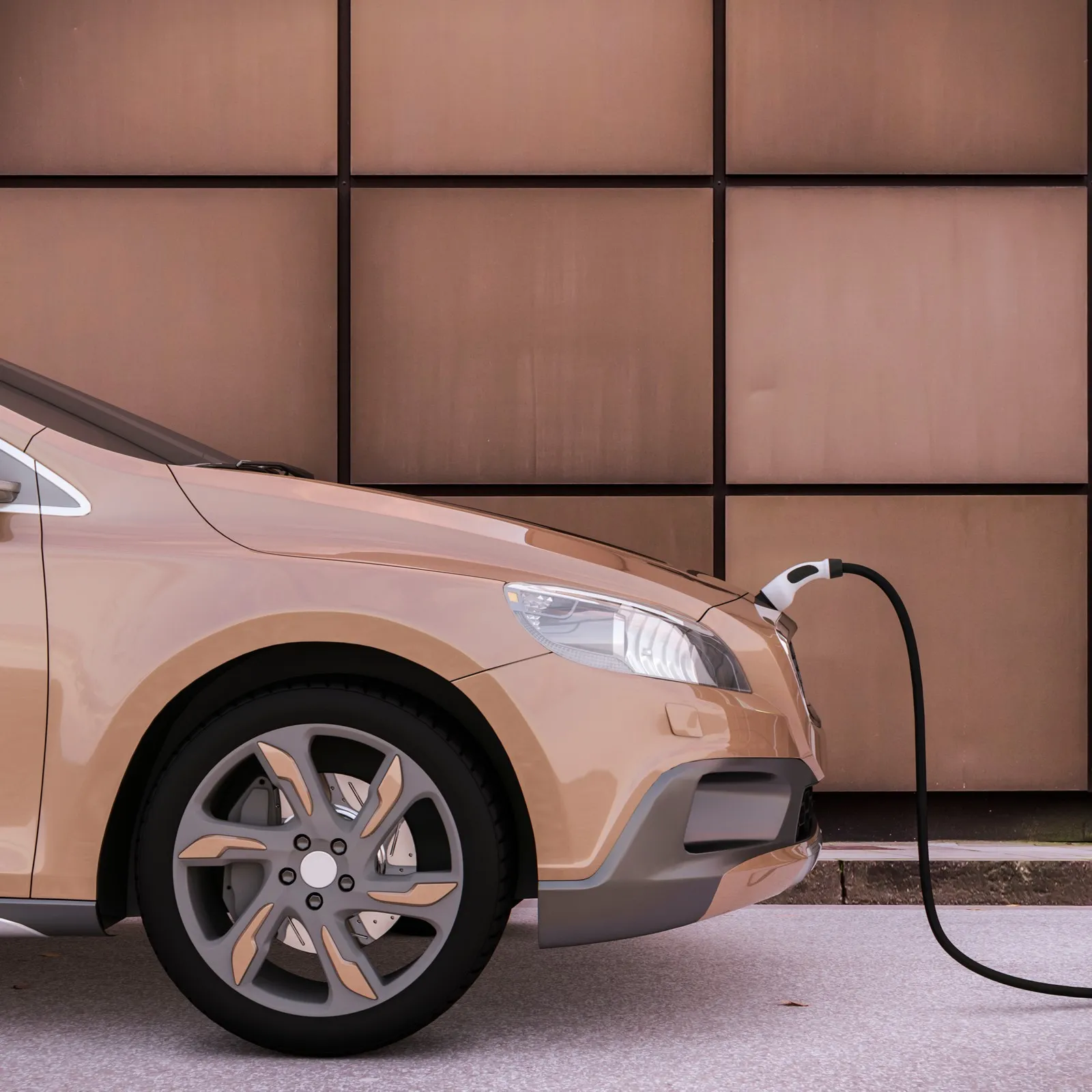 Pfirsich-farbenes E-Auto wird an einer Wallbox geladen.