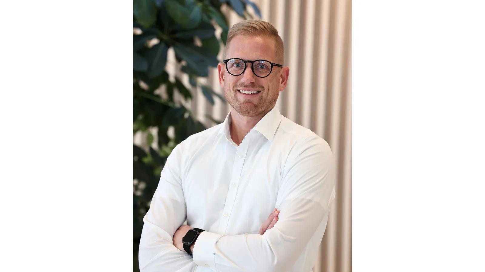 Lukas Bucher, Abteilungsleiter Corporate Mobility bei Vetter Pharma, schaut lächelnd in die Kamera.